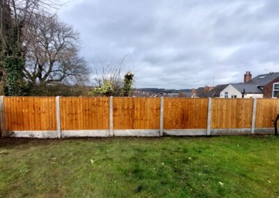 Wood and concrete garden fencing by SG Landscaping