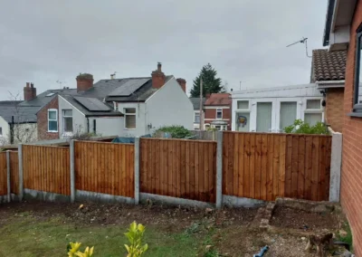 Garden Concrete and Wood Fencing by SG Landscaping
